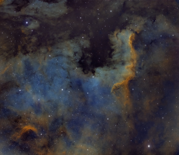 It's big, it's bright, it's colorful and complex. What's not to love about the North America Nebula? Here's a focus in on the Cygnus Wall brought to you by five-minute exposures in red, green, blue, sulfur, hydrogen, and oxygen.
